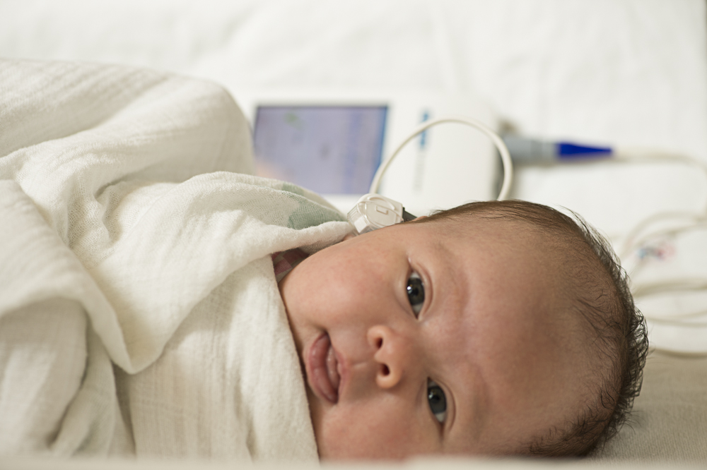 Newborn getting its hearing tested